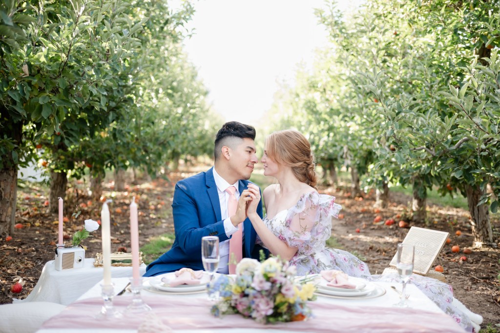 Engagement photos in an orchard taken by Shannon Eileen Photography